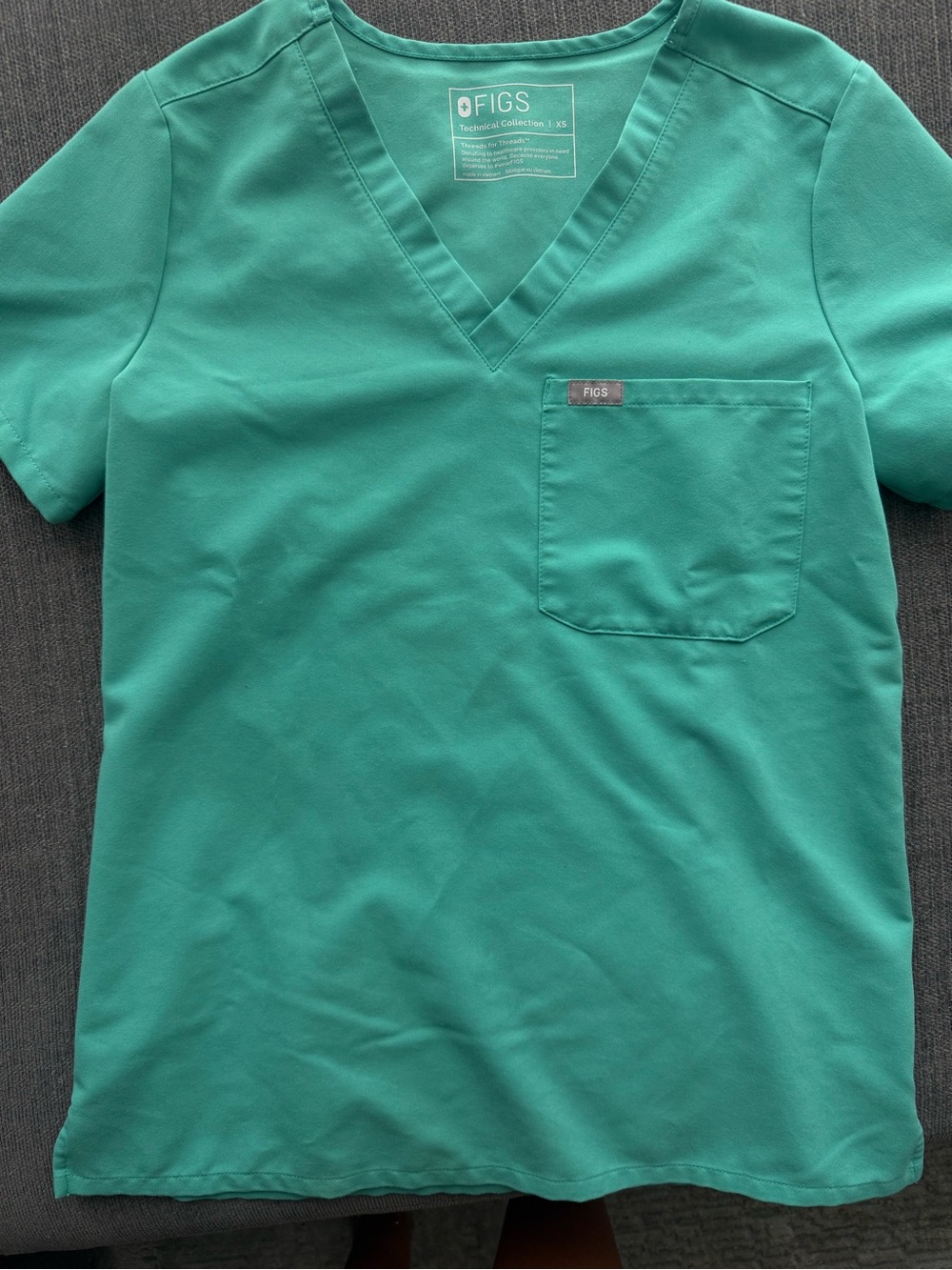 FIGS womenβs surgical green V-Neck Scrub Top